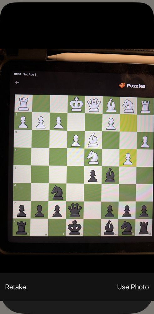 ChessView's camera step: a photograph of a chess puzzle on an iPad screen, with Retake and Use Photo at the bottom.